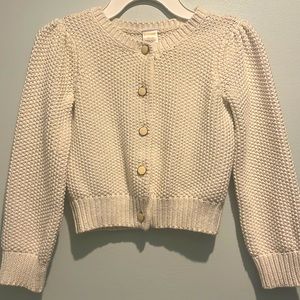 Cream colored dressy cardigan sweater with gold details